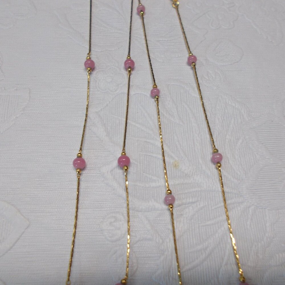 Vintage Monet pink and gold-tone necklaces; have stamped Monet on tag